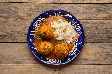 Meatballs with chipotle red sauce and rice. Mexican food