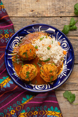 Meatballs with chipotle red sauce and rice. Mexican food