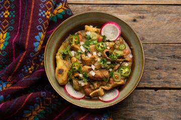 Meat in its juice is a stew with green sauce and steak. Mexican food