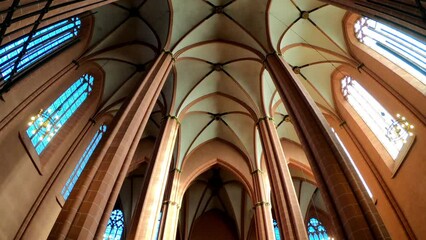 Frankfurt am Main, Germany, December 7, 2021: TILT SHOT - A view from below of four columns supporting the high, arched ceiling of Frankfurt's Saint Bartholomeus's Cathedral.  - Powered by Adobe