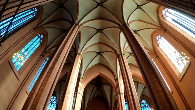 Frankfurt am Main, Germany, December 7, 2021: TILT SHOT - A view from below of four columns supporting the high, arched ceiling of Frankfurt's Saint Bartholomeus's Cathedral. 