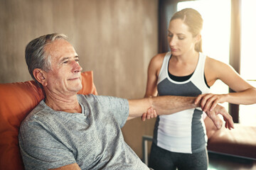 She has an aptitude for caring for others. Shot of a senior man being treated by a physiotherapist.