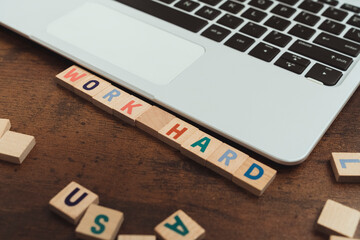 Words WORK HARD made of wooden alphabet letters concept of success . High quality photo
