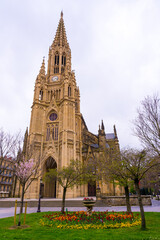 Fototapeta premium Gardens with spring flowers in the city of San Sebastian next to the Buen Pastor church in the center of the city, Gipuzkoa. Spain