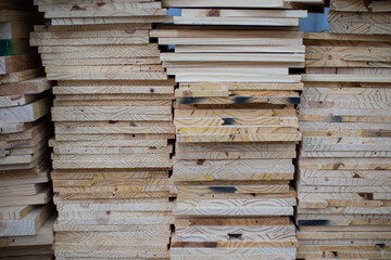 stack of different woods in a carpentry shelf
