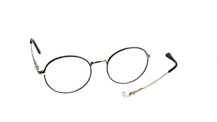 broken vintage glasses on a white background. broken eyeglasses