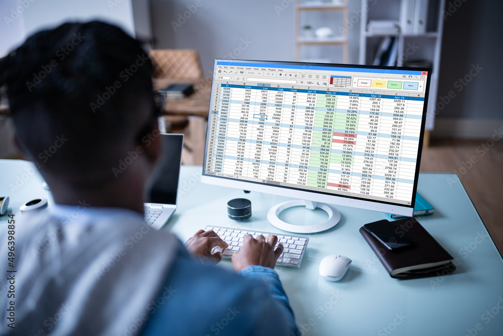 Poster man using finance spreadsheet report