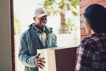 Told you we promise a speedy service. Shot of a courier making a home delivery to a customer.