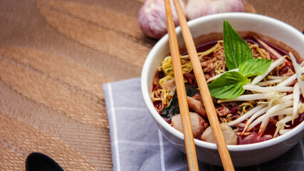 Thai noodle with pork is a street food that is commonly sold in Thailand. Also known as 