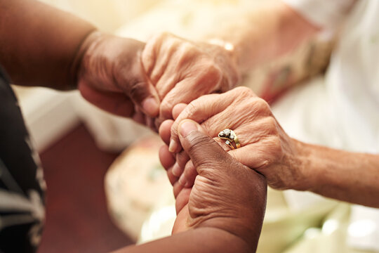 Kindness. Pay it forward. Cropped shot of a senior woman holding her friends hands in comfort.