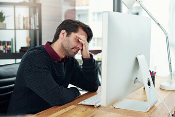 All that work and I forgot to save it. Cropped shot of a young businessman looking dismayed by...