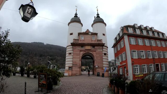 Heidelberg, Germany, December 9, 2021: TILT SHOT - The Karl Theodor Bridge with Stadttor gate, Baden Wurttemberg, Germany.