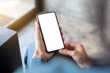 cell phone blank white screen mockup.hand holding texting using mobile on desk at office.background empty space for advertise.work people contact marketing business,technology