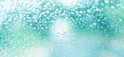 blurry raindrops at the windshield, selection focus.soft raindrops background.