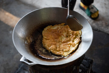 Thai style omelet in Thai street food restaurant