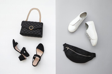 Black heeled sandals, bag with chain strap, white sneakes and fanny pack (waist pack) on grey and...
