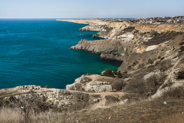 View of Crimean rugged rocky with Diana's Grotto and beach from top of the cliff on Fiolent Cape. Sevastopol. Crimea