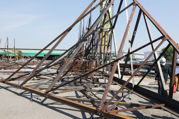 Assembly of steel tower with bolt and nut on site