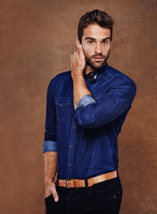 Rugged good looks and style. Studio shot of a stylishly dressed young man.