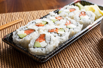 A view of a philly sushi cut roll.