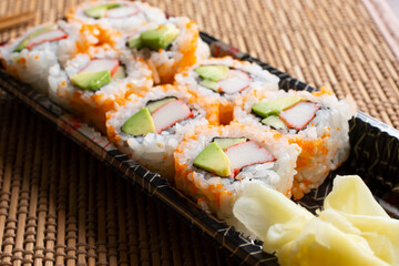 A view of a California roll garnished with masago. © DAVID