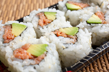 A view of a tray of spicy tuna roll.