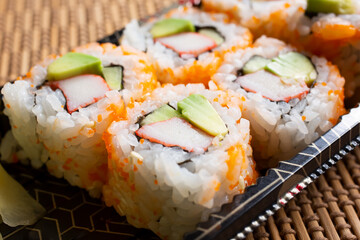 A view of a California roll garnished with masago. © DAVID