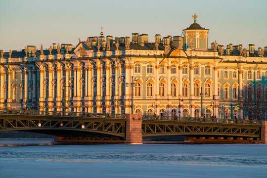 Fragments of the Winter Palace and the Palace Bridge on a sunny February evening. Historic center of St. Petersburg, Russia