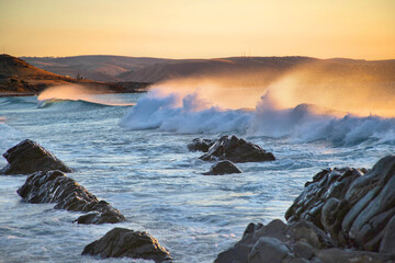 Landscape with ocean waves in sunset light