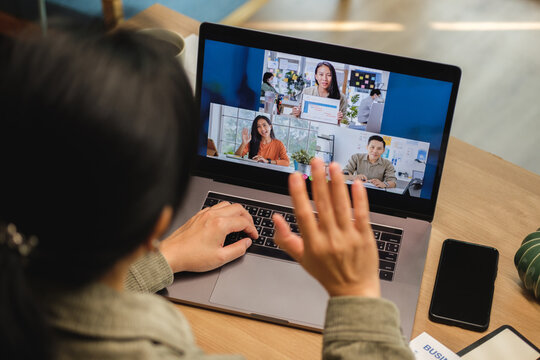 asisn woman video conference busienss meeting with colleage online with laptop at home