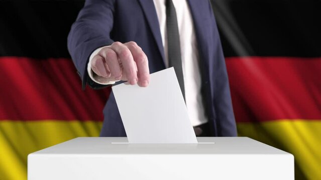 Voting. Man Putting a Ballot into a Voting Box with German Flag on Background. 
