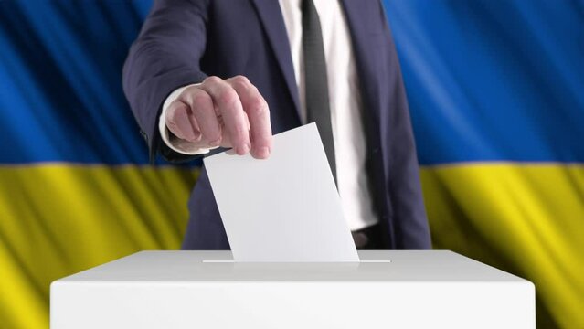Voting. Man Putting a Ballot into a Voting Box with Ukrainian Flag on Background. 