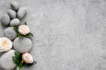 Fototapeta na wymiar Relax composition with spa stones and pink roses