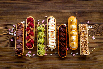 Set of french dessert eclairs with colorful topping