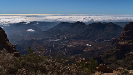 Panoramic view over the central mountains of island Gran Canaria, Canary Islands, Spain with village San Bartolome de Tirajana on sunny day in winter.