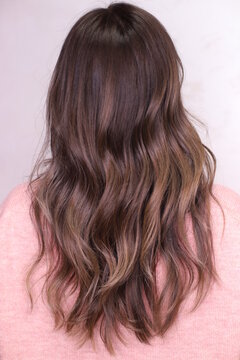modern hairstyle. the brunette. the hair was dyed in the ombre technique.