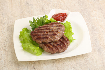 Grilled beef burger cutlet with sauce