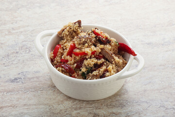 Arabic cous cous with meat and tomato