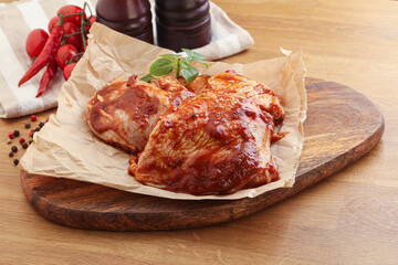 Marinated chicken leg in tomato sauce