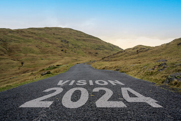 Vision 2024 written on a mountain pass road in the Lake District.