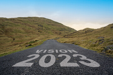 Vision 2023 written on a mountain pass road in the Lake District.