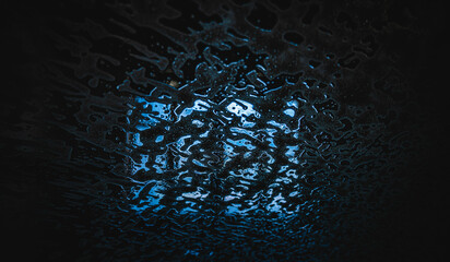 Foam on the windshield of a car going through a carwash to get clean, shiny and fresh