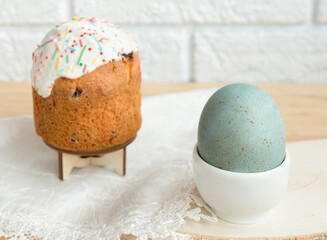 Easter egg and cake on the table. Close-up. Selective focus