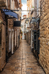 Old Town Budva, Montenegro. The first mention of this city - more than 26 centuries ago. We see ancient houses, a very narrow street, cafes, shops.