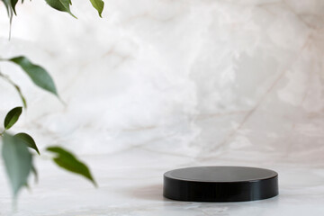 mockup with a round black pedestal for mounting your product