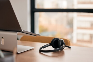 Obraz na płótnie Canvas Communication is vital to success. Still life shot of a wireless headset on a desk in a call center.