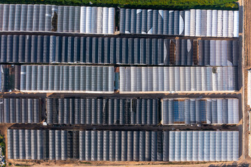 Greenhouse farming, vast land utilized for greenhouse agriculture, Aerial view.