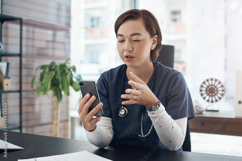 Poster everything should be fine if you do all those things. shot of a young doctor using a cellphone in an