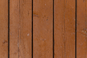 Fototapeta premium Vertical wooden brown boards. Background with cracked old paint.