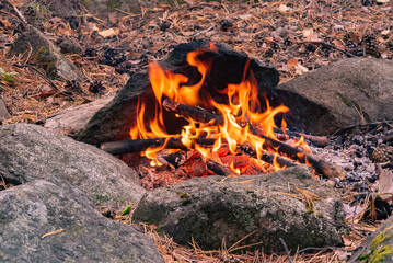 Bonfire in the mountains, among the stones.